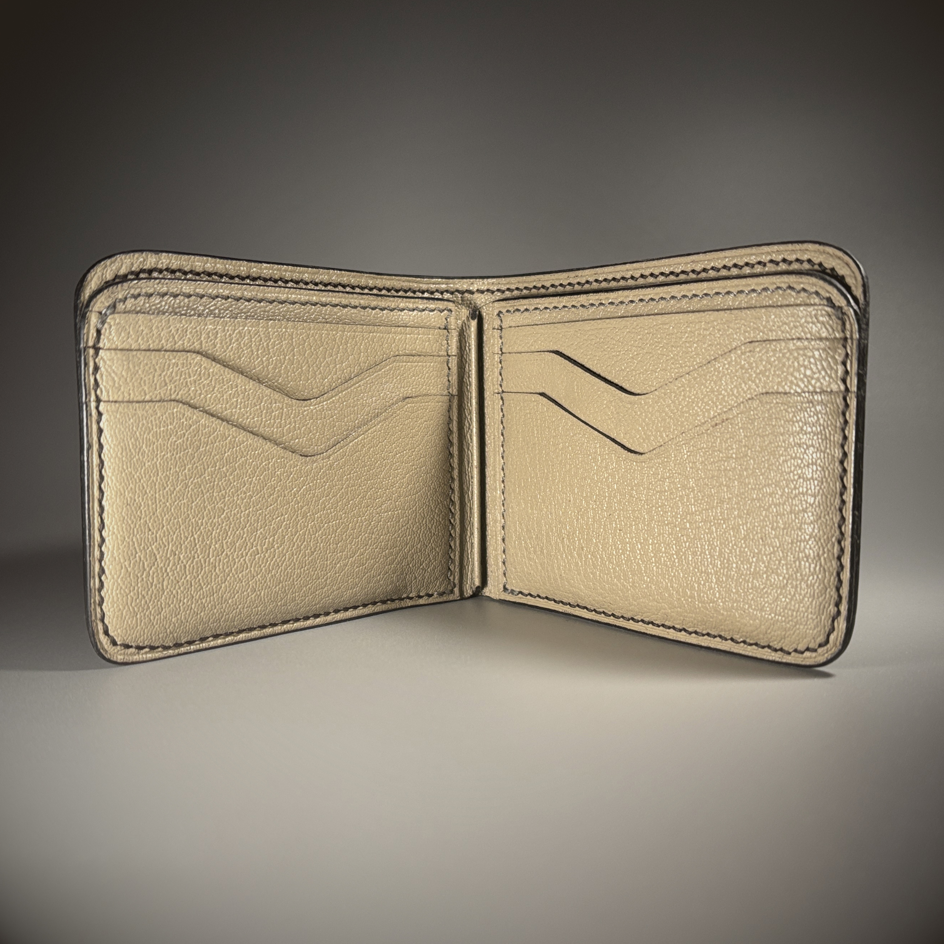 Unique handstitched black shark leather shell and light tan chevron patterned interior bifold wallet interior view