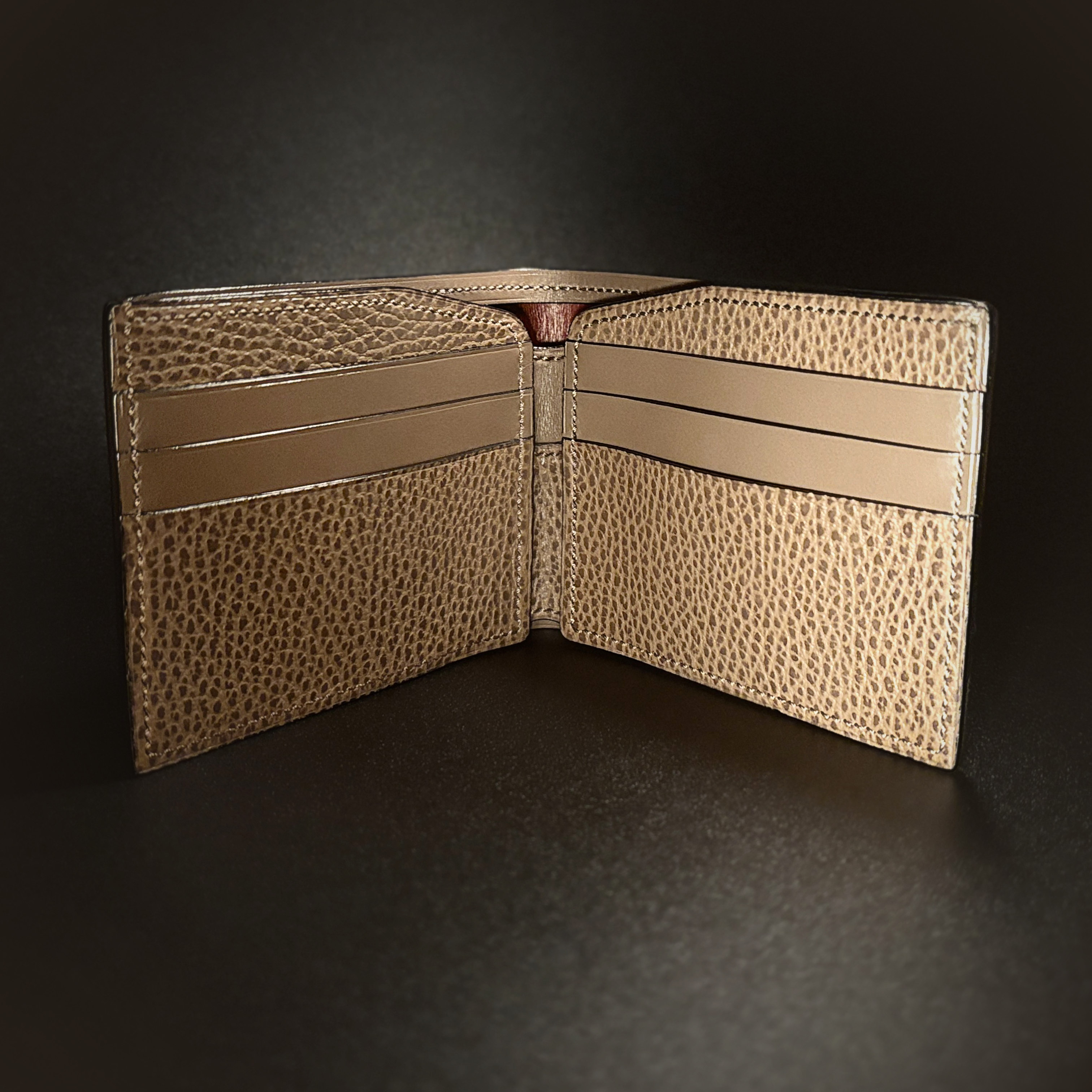 Unique handstitched textured taupe with red accent cash compartment bifold wallet interior view