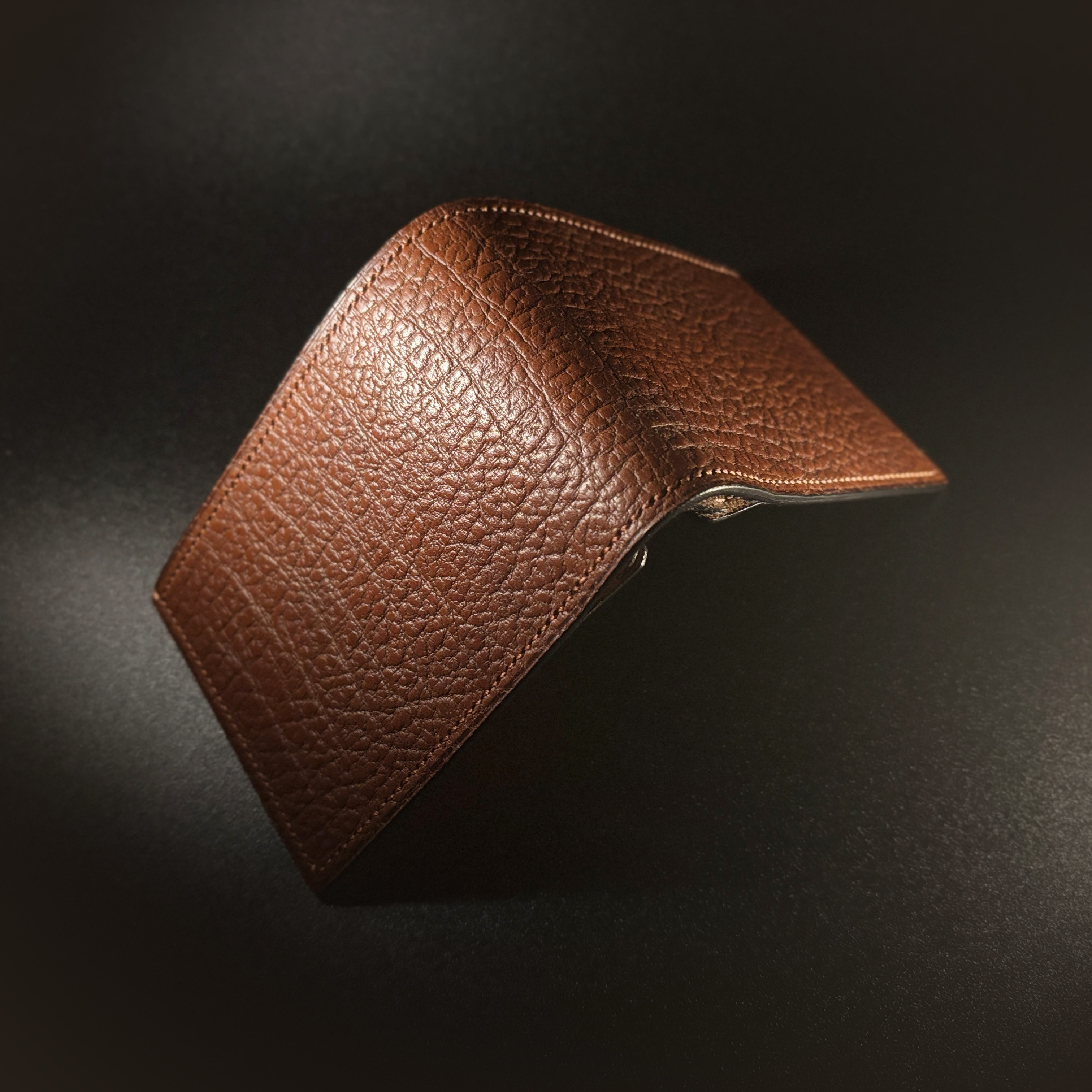 Unique handstitched textured terrracotta brown bifold wallet exterior shell view