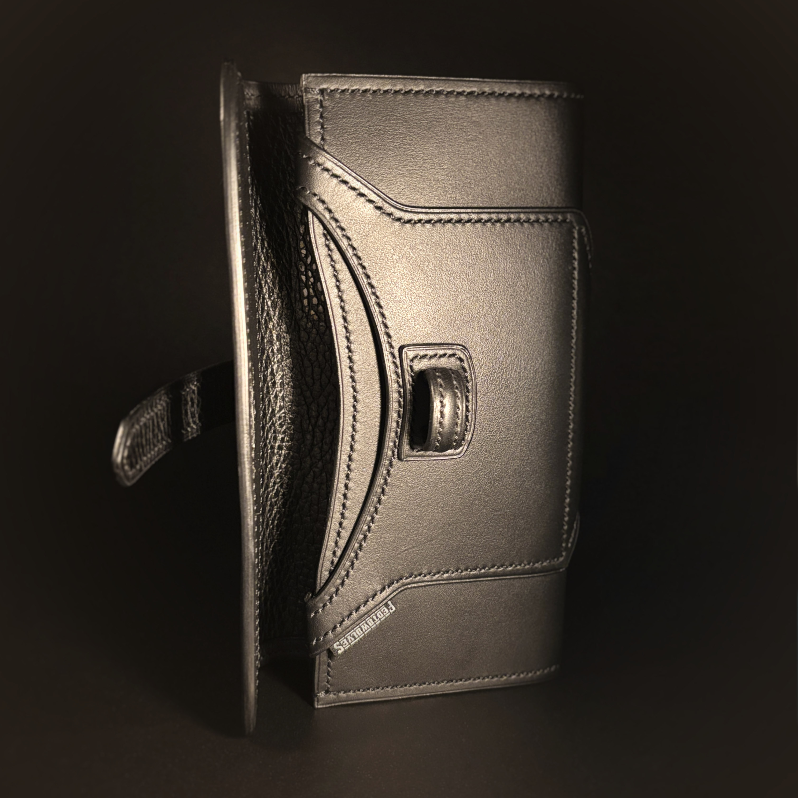 Luxury handstitched matte black clutch purse with unique tab closure view of front of opened purse