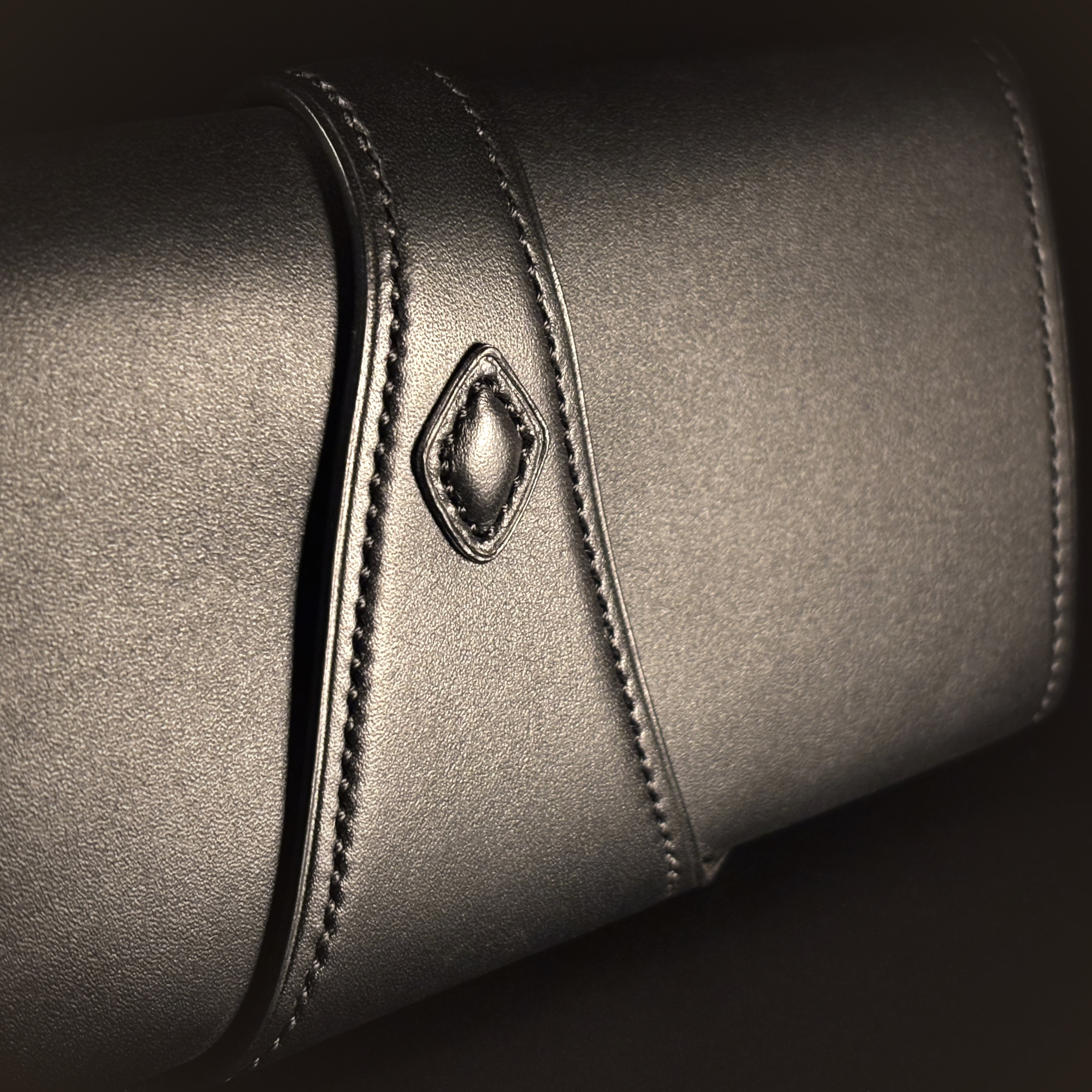 Luxury handstitched matte black clutch purse with unique tab closure detailed view of purse back