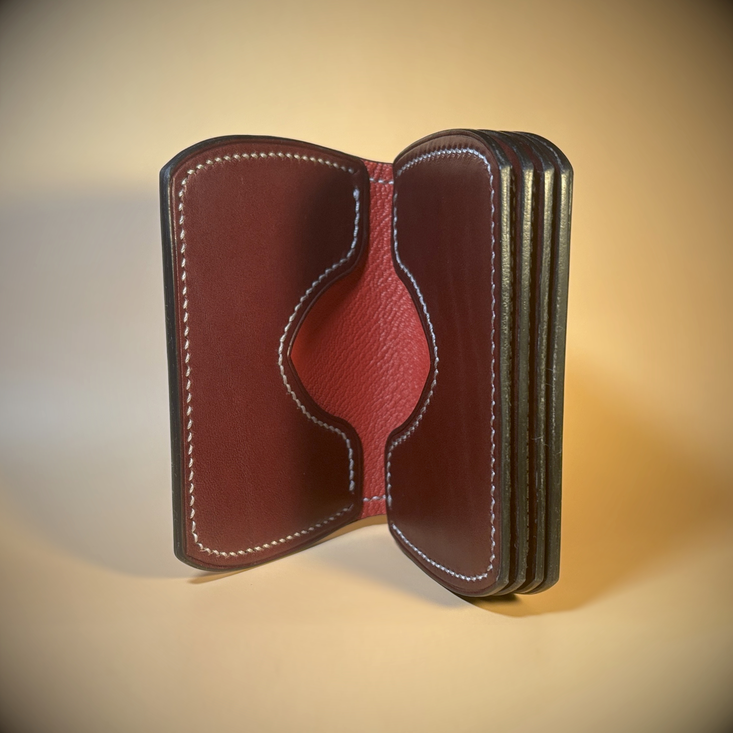 Unique folding red and oxblood hand stitched card wallet detailed interior view