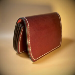 Unique folding red and oxblood hand stitched card wallet detailed exterior shell view