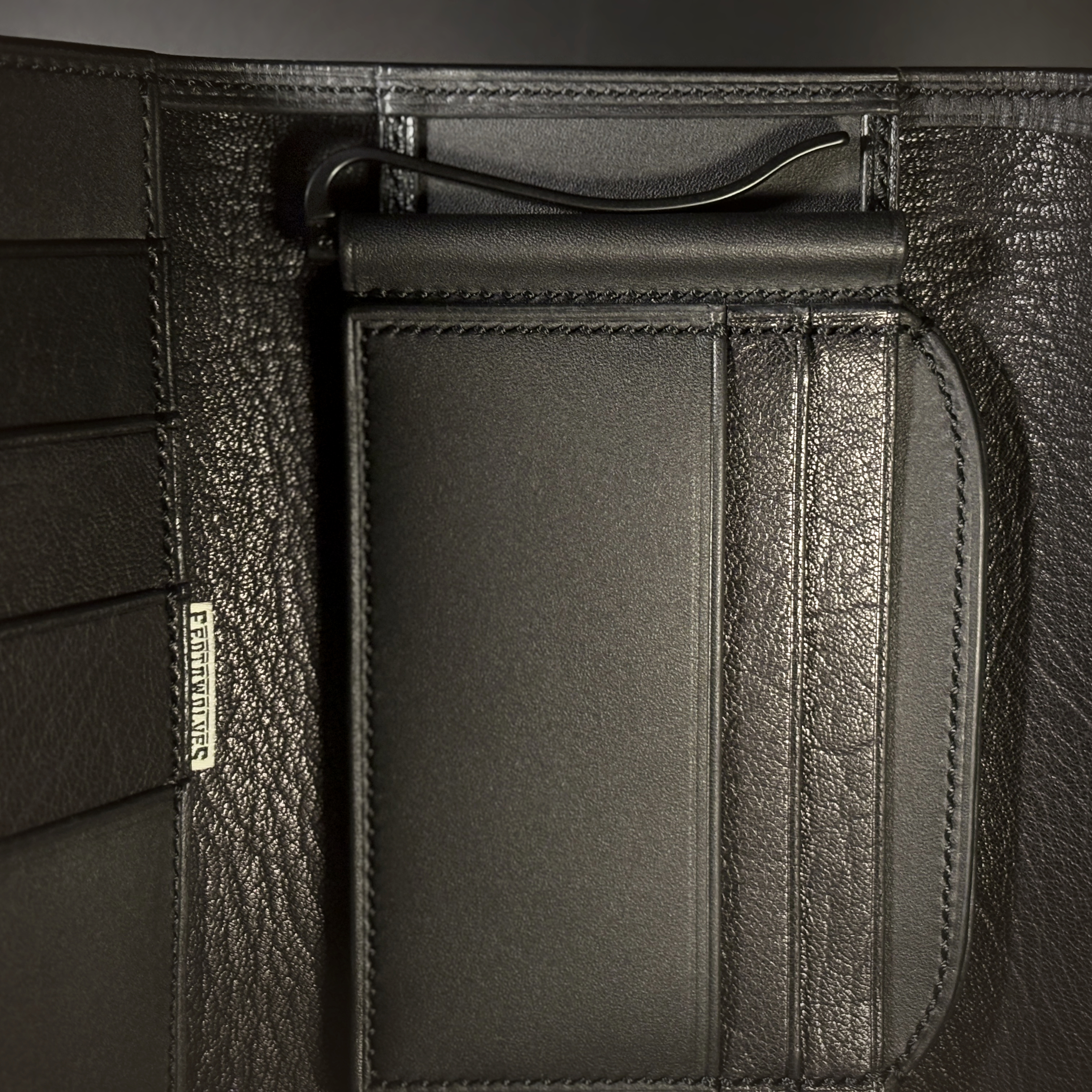 Unique all black hand-stitched tuck strap closure card and cash wallet with money clips detailed money clip view