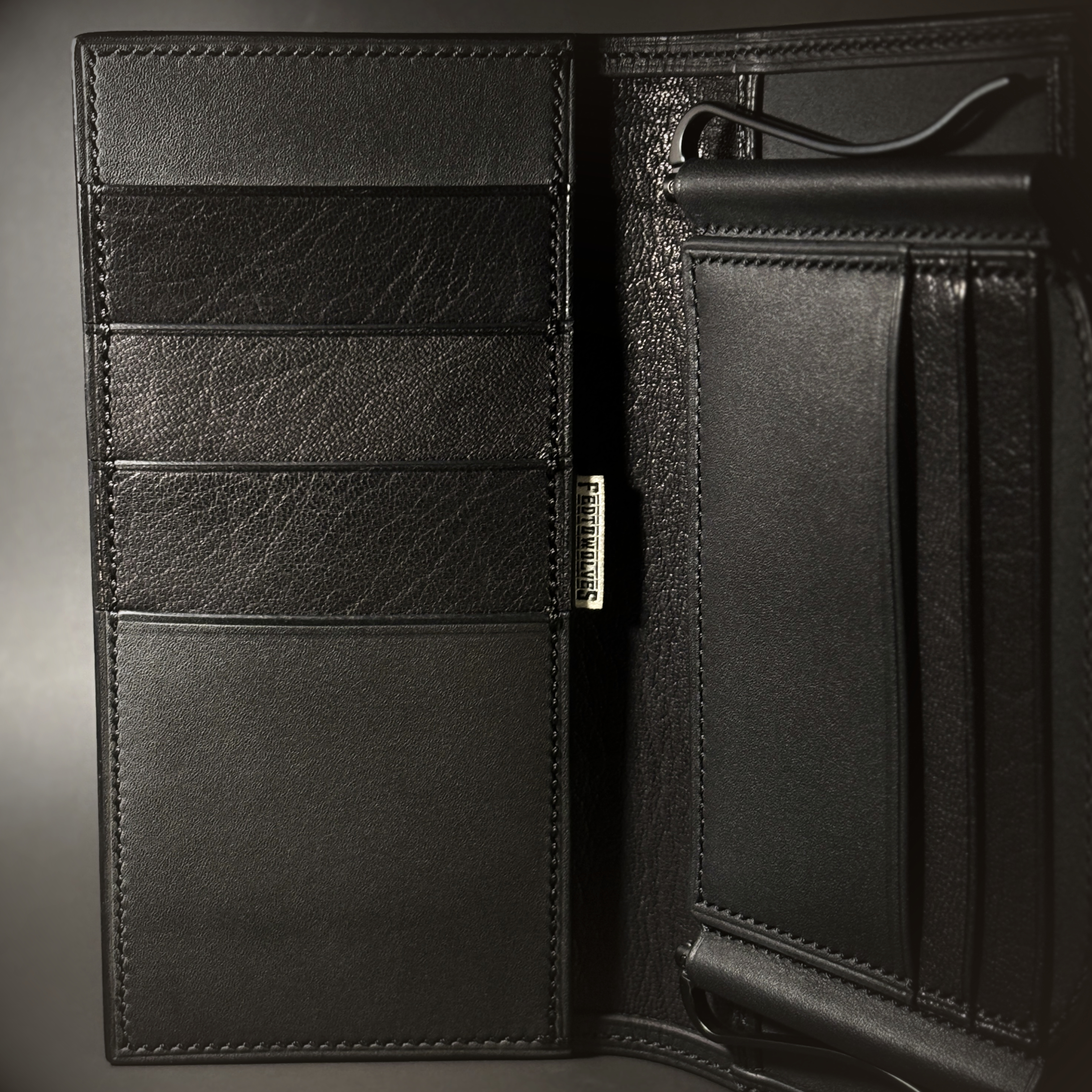 Unique all black hand-stitched tuck strap closure card and cash wallet with money clips detailed interor view