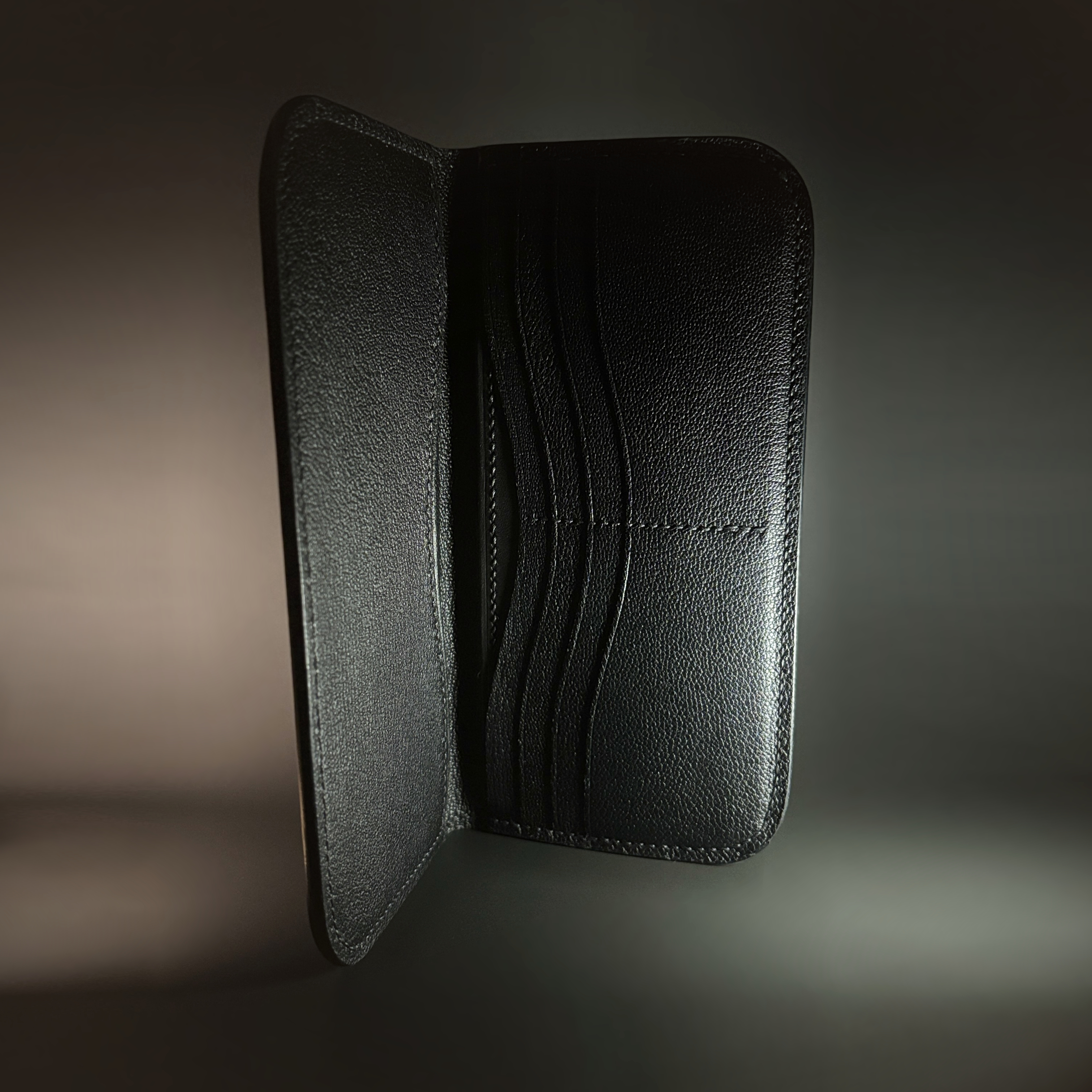 Unique handstitched stingray and quilted shell and black curved interior long wallet side interior view