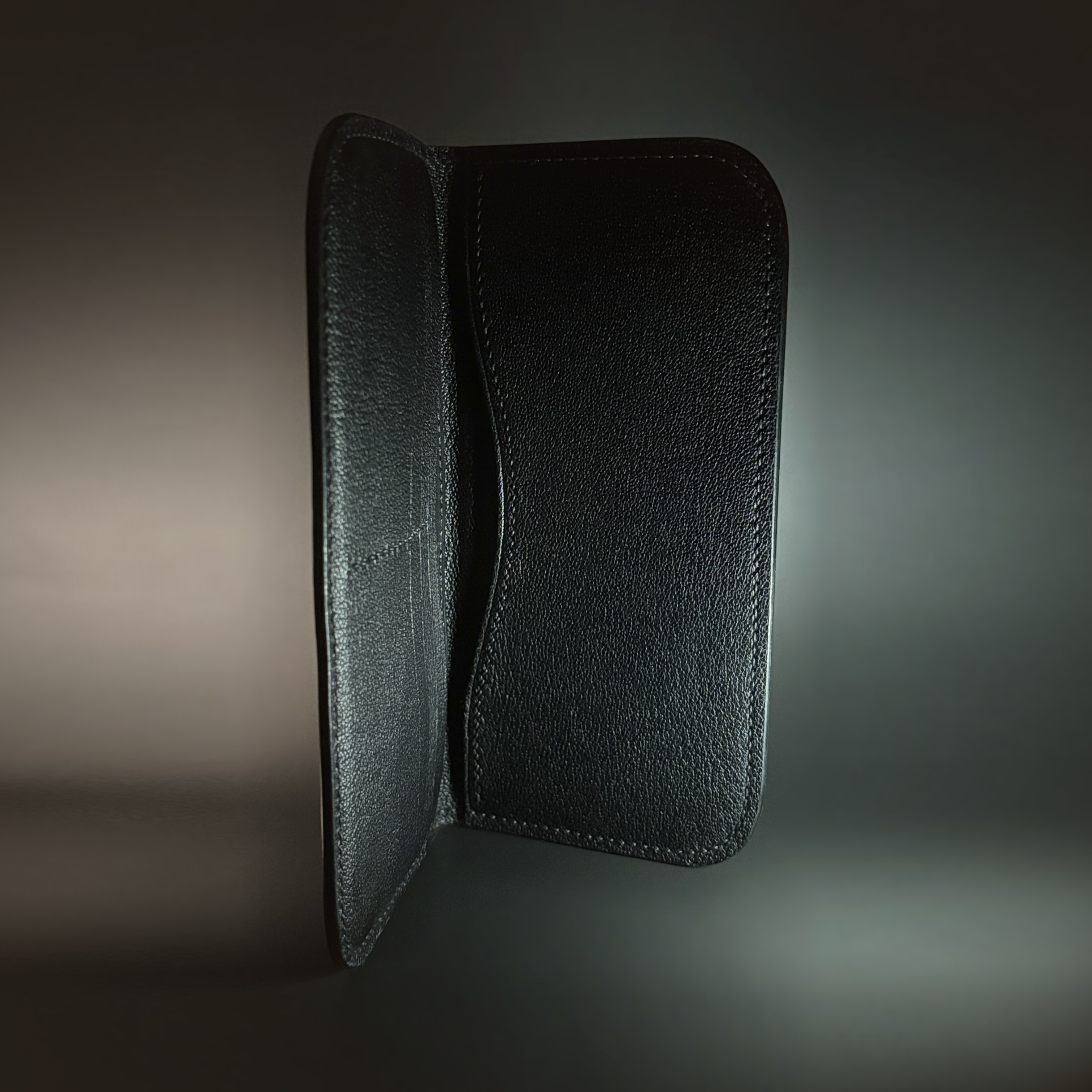 Unique handstitched stingray and quilted shell and black curved interior long wallet side interior view