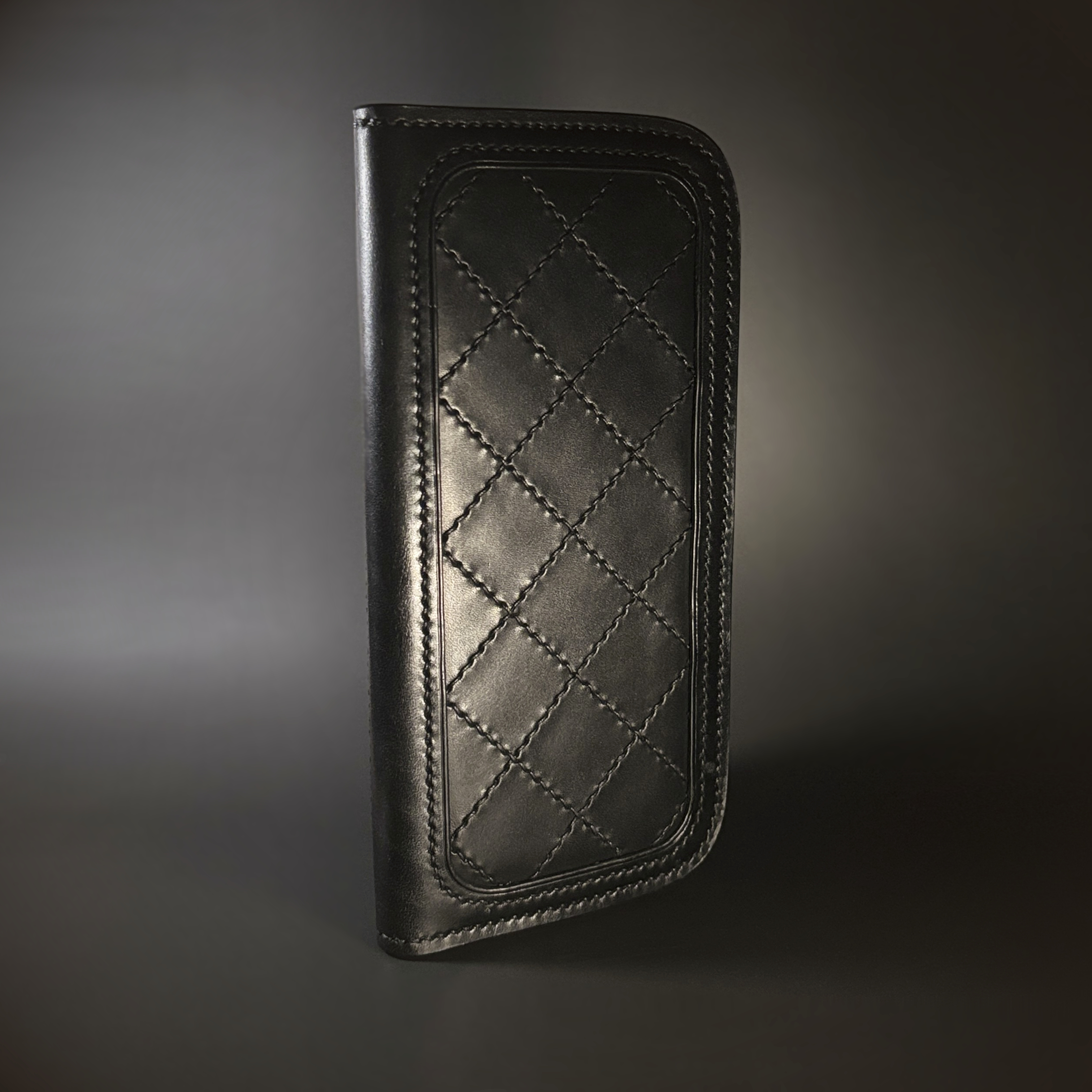 Unique handstitched stingray and quilted shell and black curved interior long wallet side quilted exterior view