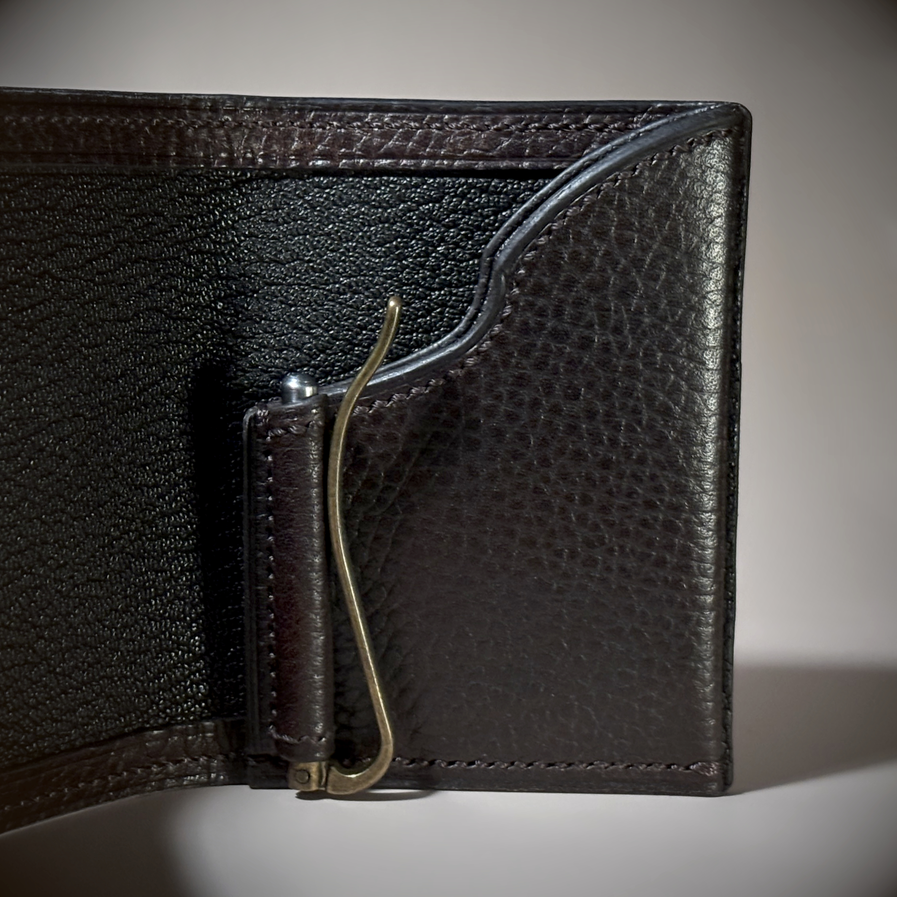 Unique hand-stitched brown and black wallet with money clip detailed view
