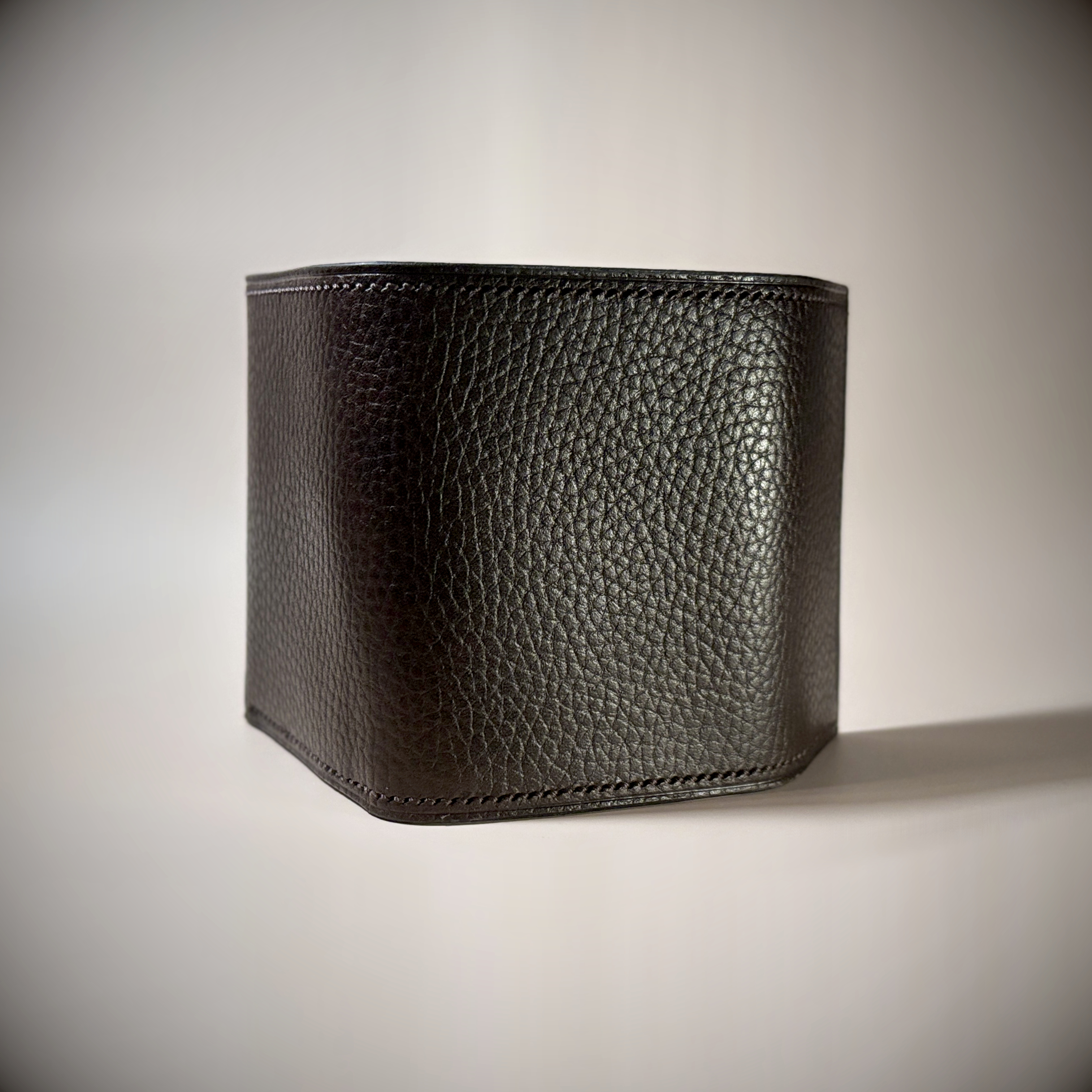 Unique hand-stitched brown and black wallet with money clip exterior shell view