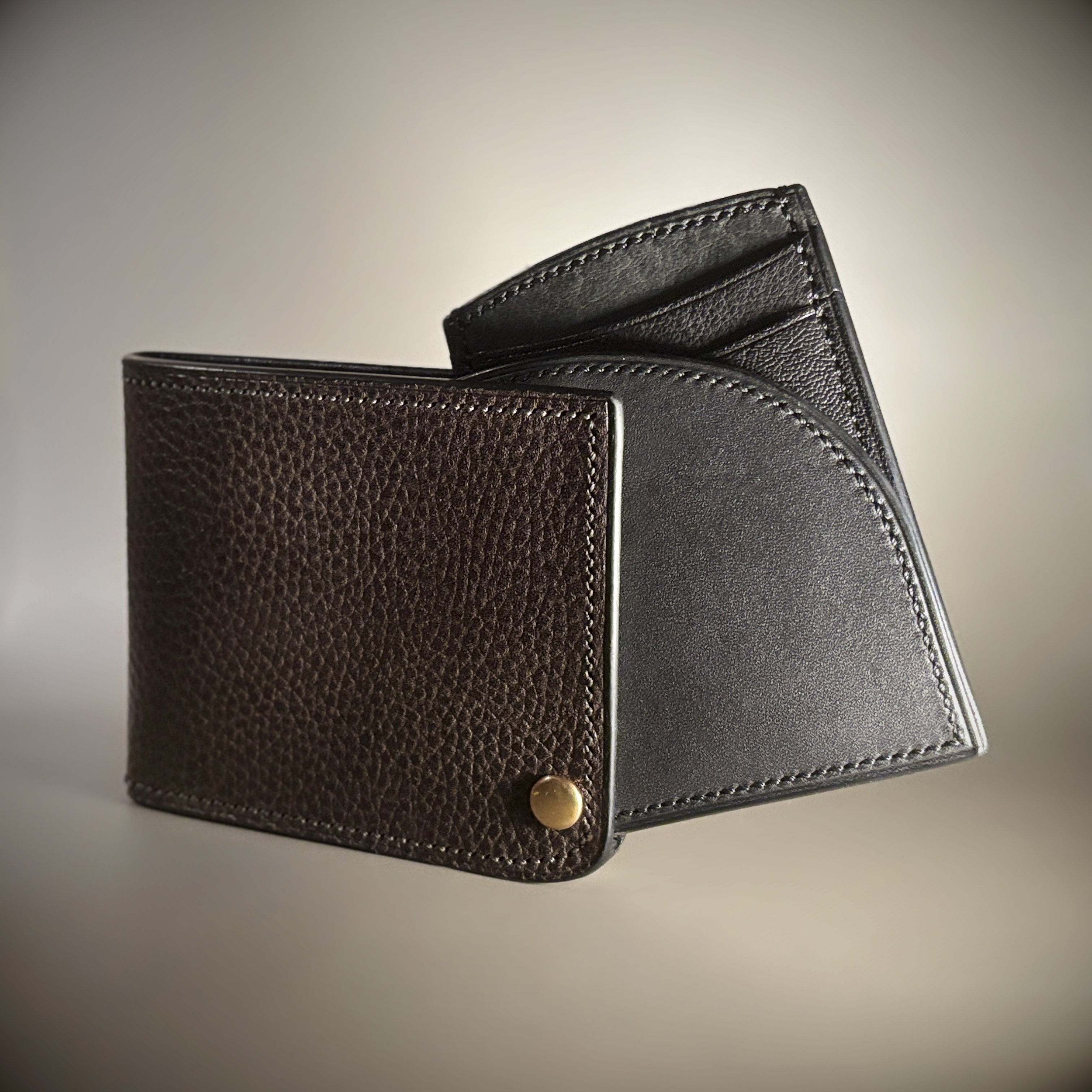 Unique hand-stitched brass hinged brown and black wallet exterior hinge open view