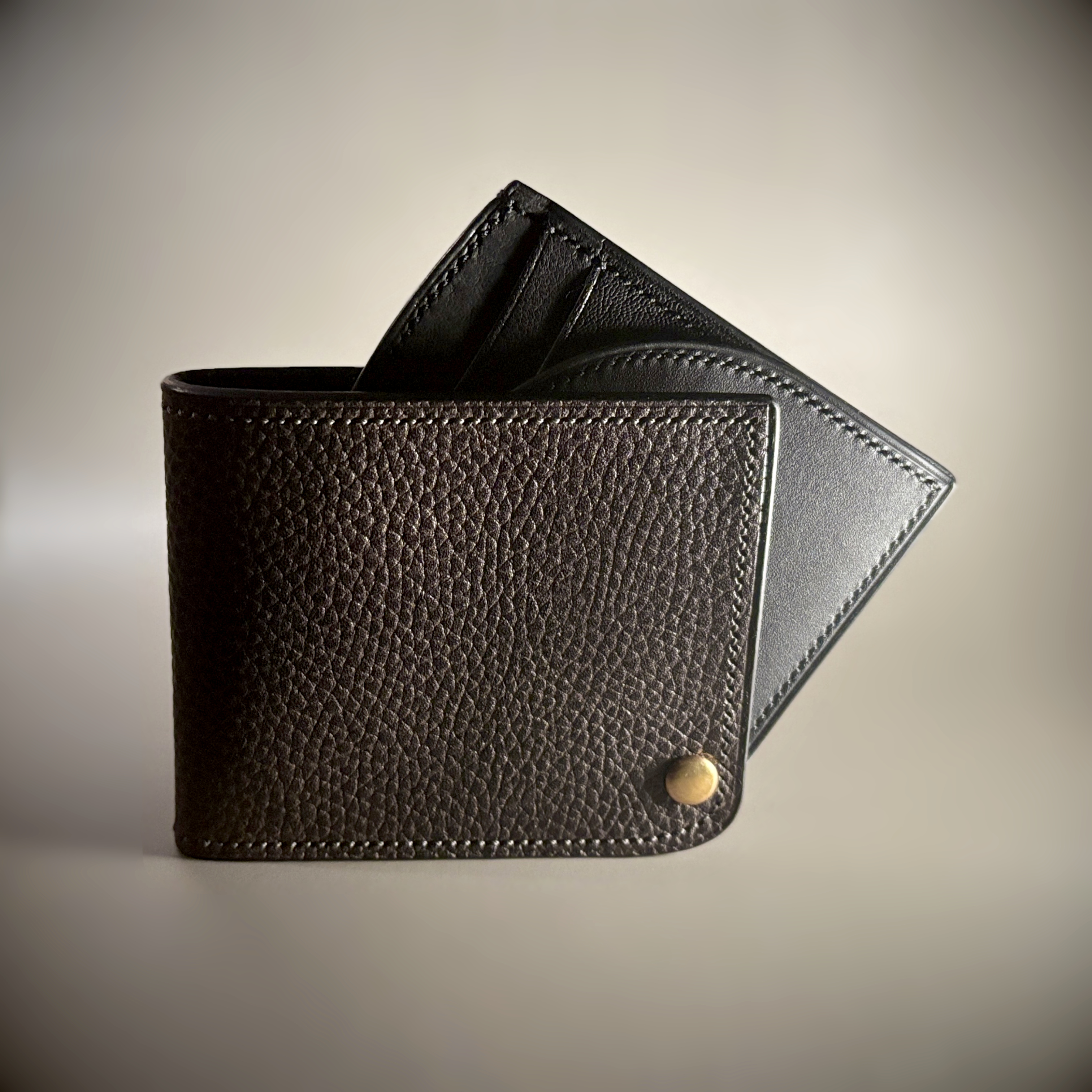 Unique hand-stitched brass hinged brown and black wallet exterior hinge open view